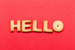 Word hello cookie over the red background